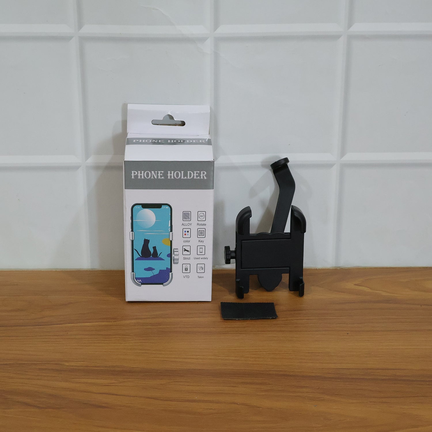Metal bike phone holder mounted on a bike's rear view mirror, demonstrating easy installation.