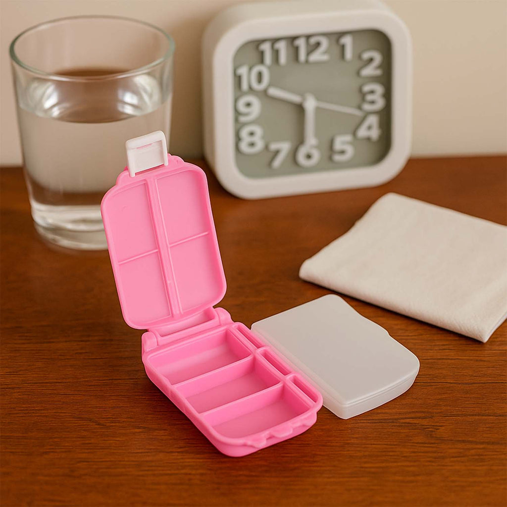 Compact and portable pill organizer showing both sides open