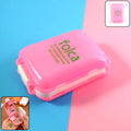 Pink dual-sided pill organizer box closed to prevent spills