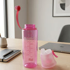 Pink sports water bottle with easy-carry loop attached