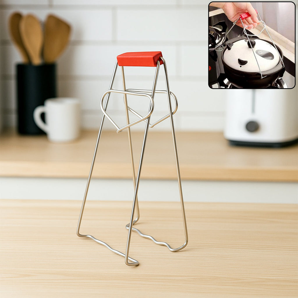 Stainless steel vessel gripper tong securely gripping a hot kitchen dish