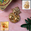 Traditional golden Lord Ganesha kumkum dish with embossed design and dual compartments