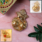 Traditional golden Lord Ganesha kumkum dish with embossed design and dual compartments