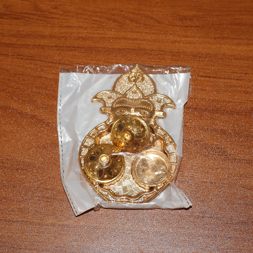 Decorative dual compartment kumkum holder with a golden finish for religious use
