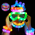 Children happily stretching and connecting colorful pop tubes.