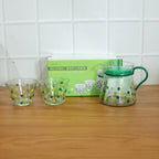 Transparent tea pot with matching cups, ideal for hot tea serving