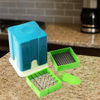 Potato chipper cutter slicing fresh potatoes for French fries