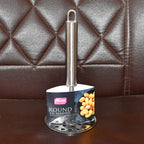 Kitchen scene showing stainless steel potato masher in use