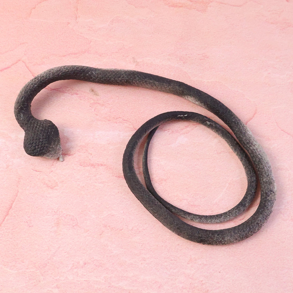 Lifelike fake snake toy designed for kids’ pranks and garden protection
