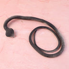 Lifelike fake snake toy designed for kids’ pranks and garden protection