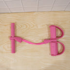 Exercise in progress using pull rope resistance exerciser