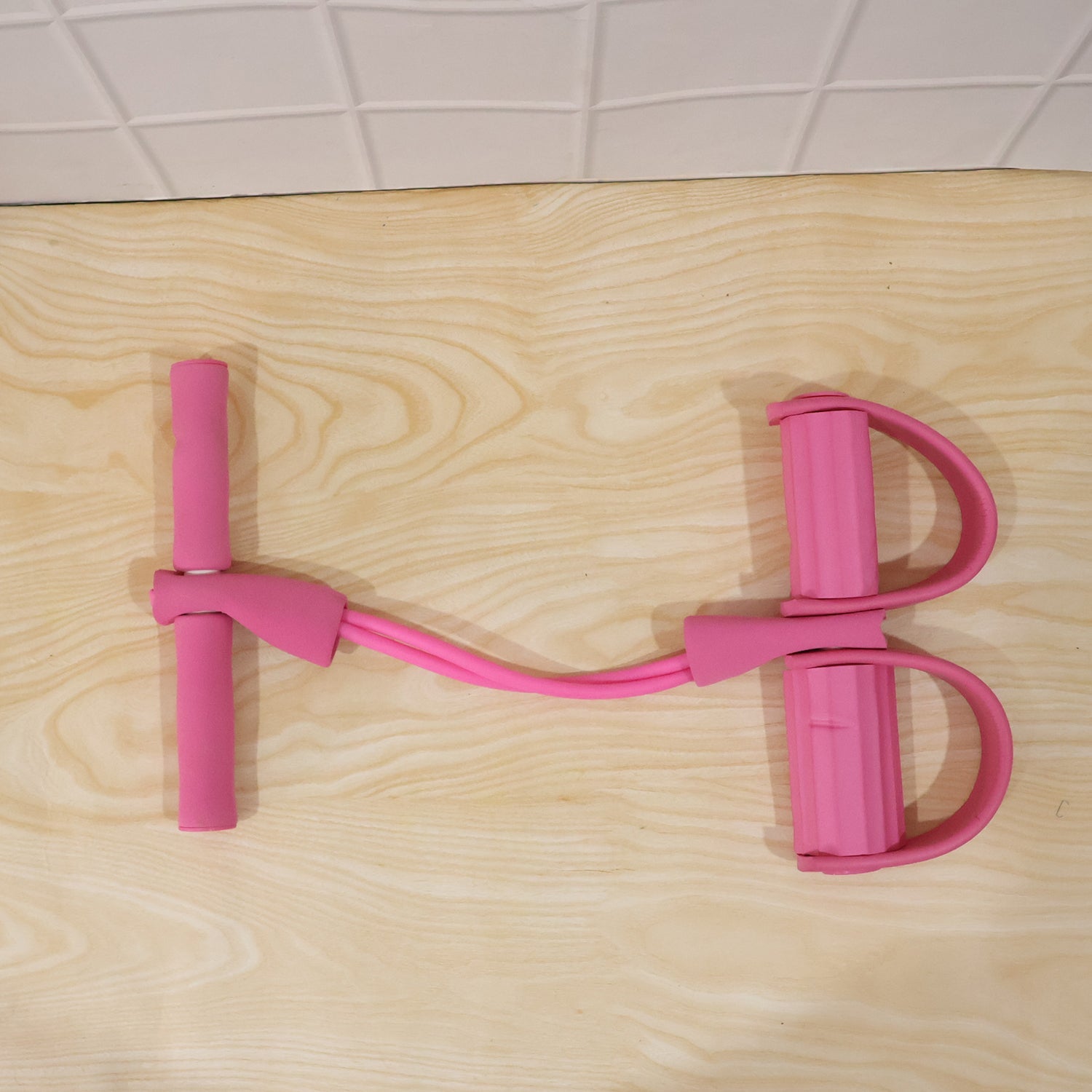 Exercise in progress using pull rope resistance exerciser