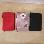 Open makeup organizer bag with cosmetics and brushes inside
