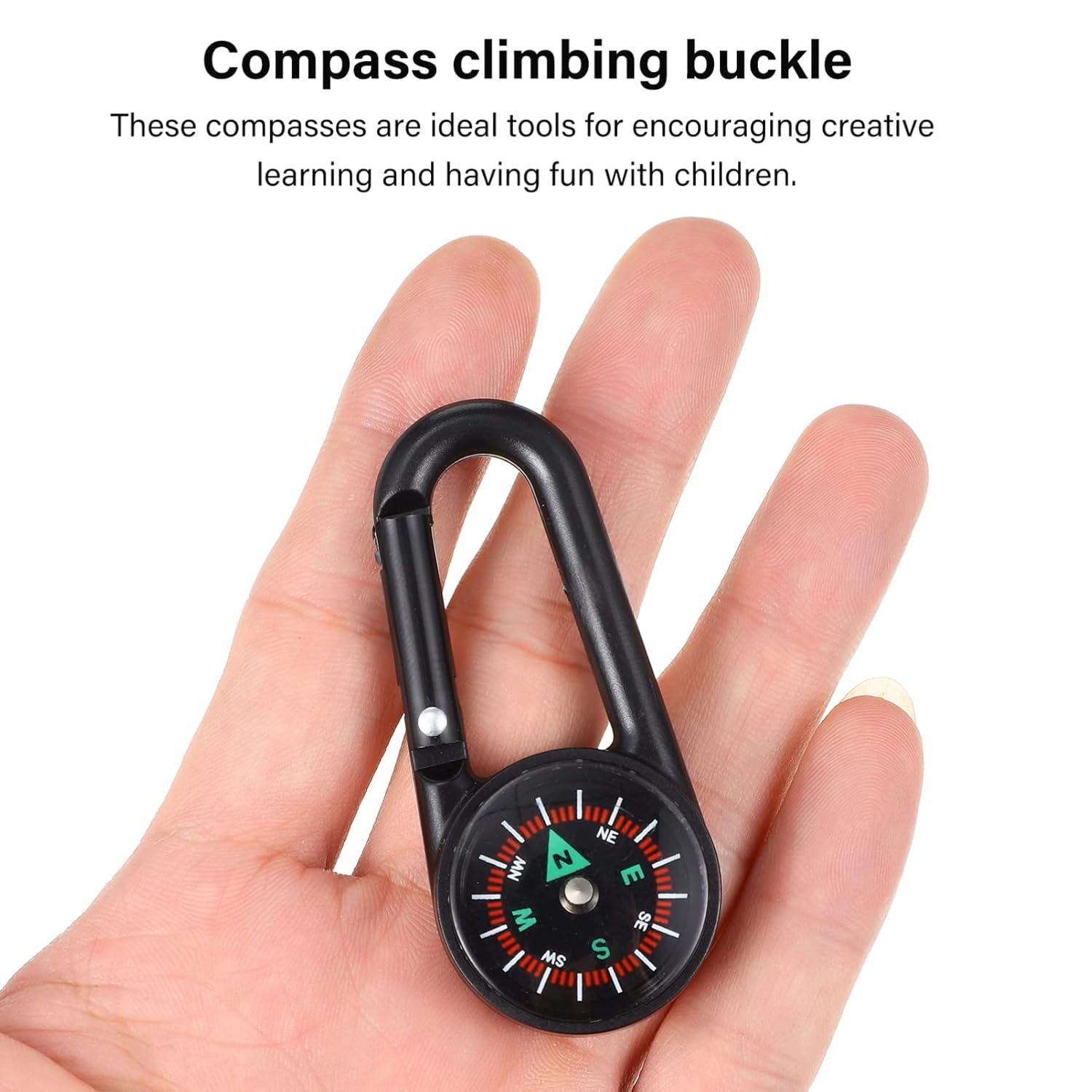 A person holding the mini compass with clip, demonstrating its portability and ease of handling.