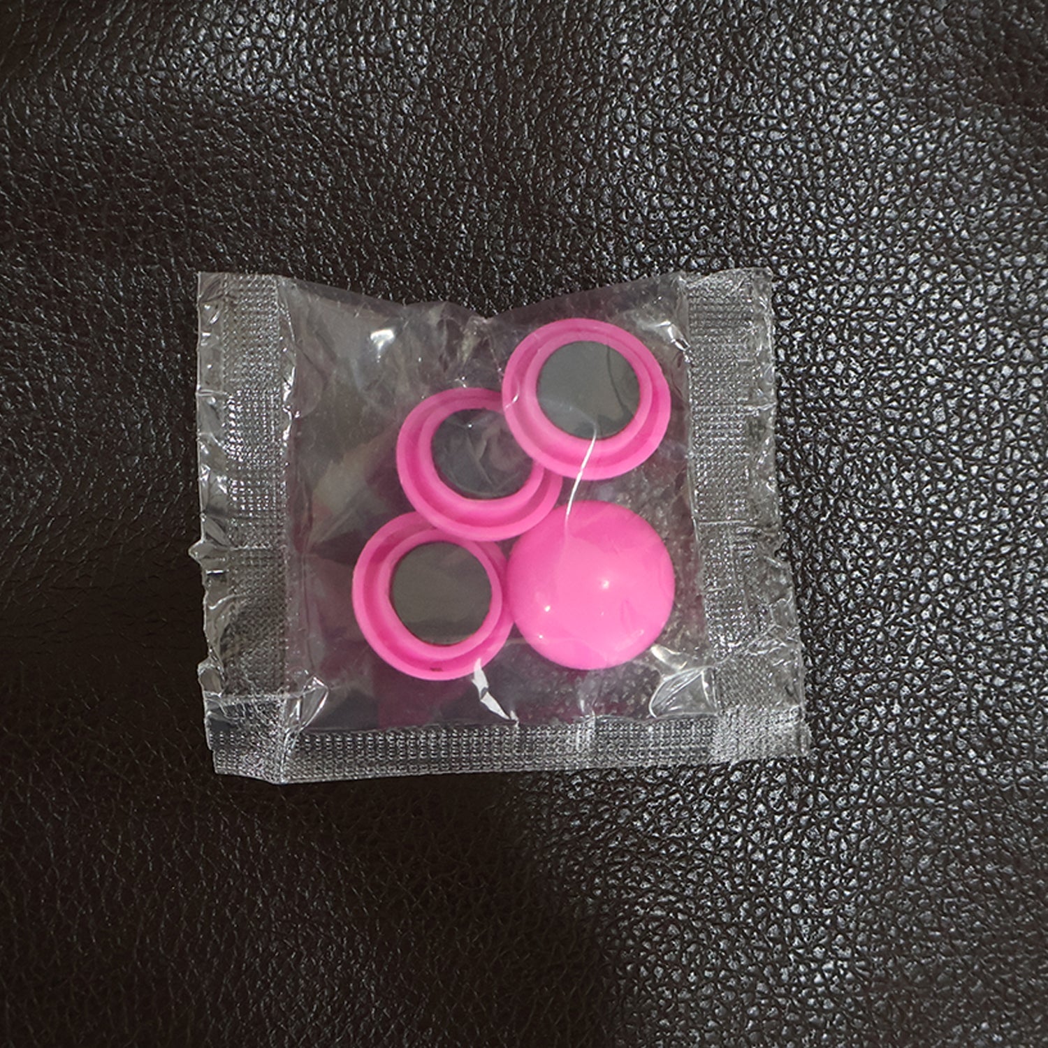 A collection of Round Fridge Magnets in multiple hues, perfect for home and office use.