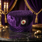 Close-up of decorative stone brooch on velvet boys cap