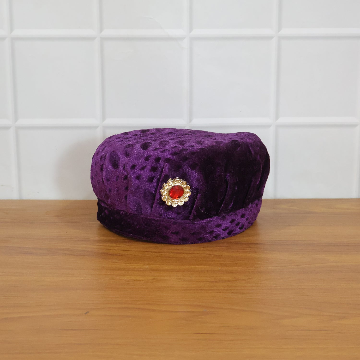 Festive setting with a boy wearing velvet traditional cap