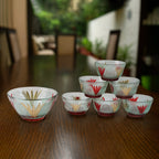 Seven-piece glass serving bowl set, perfect for various Indian desserts and snacks.