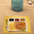 Divided plastic meal tray with raised edges preventing spills.