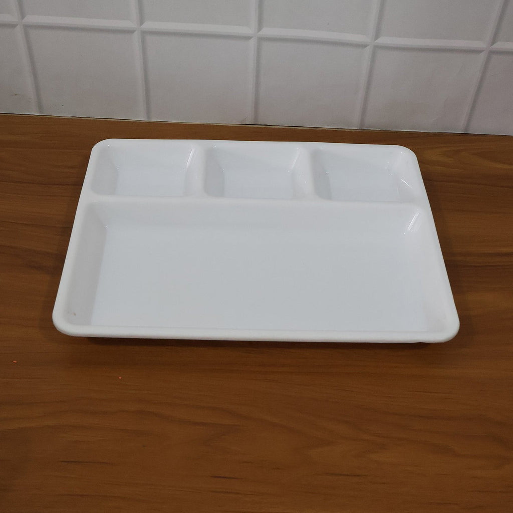 A 4-compartment serving tray filled with a balanced Indian meal.