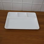 A 4-compartment serving tray filled with a balanced Indian meal.