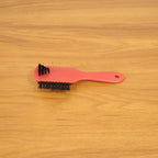 Shoe cleaning brush in use cleaning sneakers to remove dirt and stains