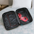Side view of suitcase showing handle and wheels from the set