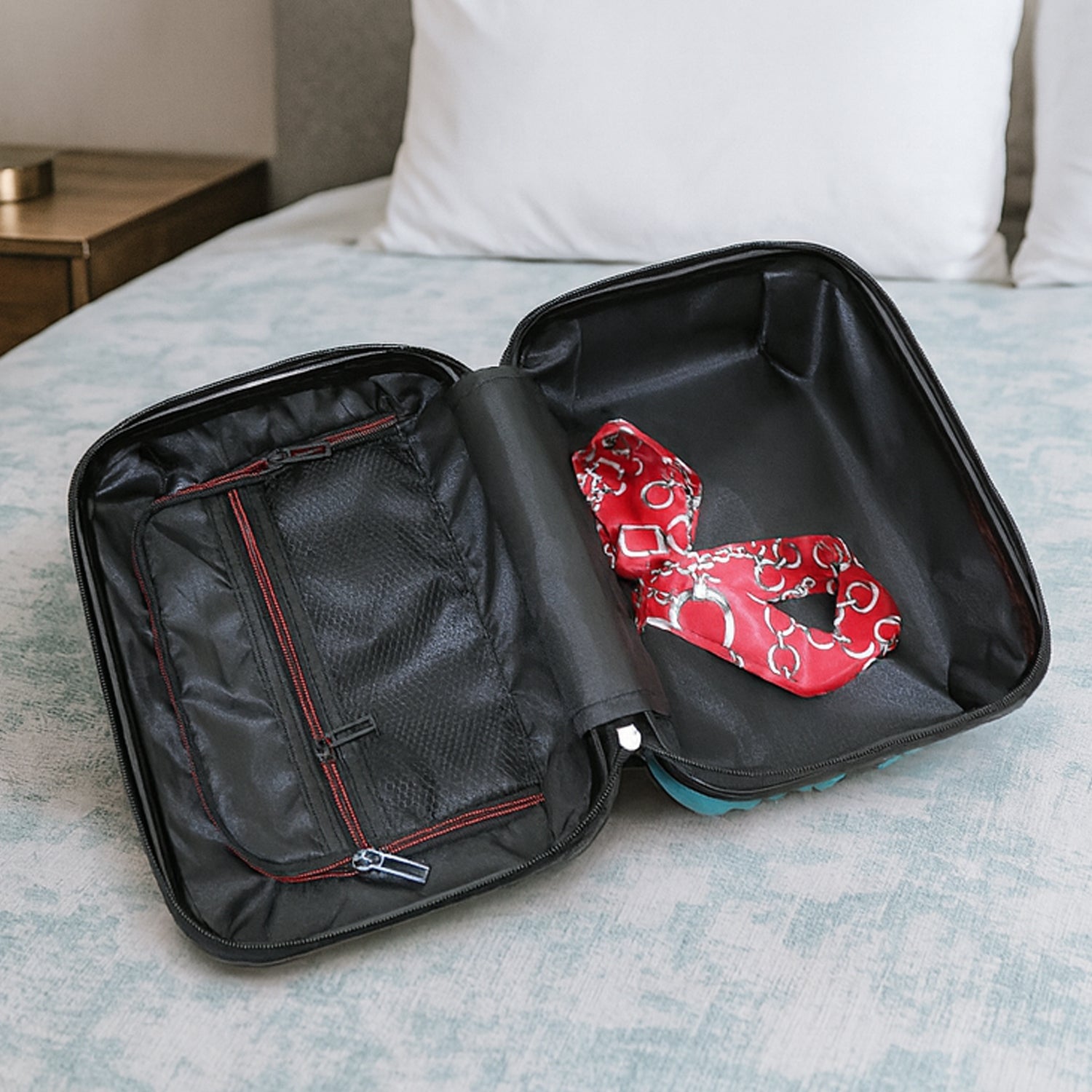 Side view of suitcase showing handle and wheels from the set