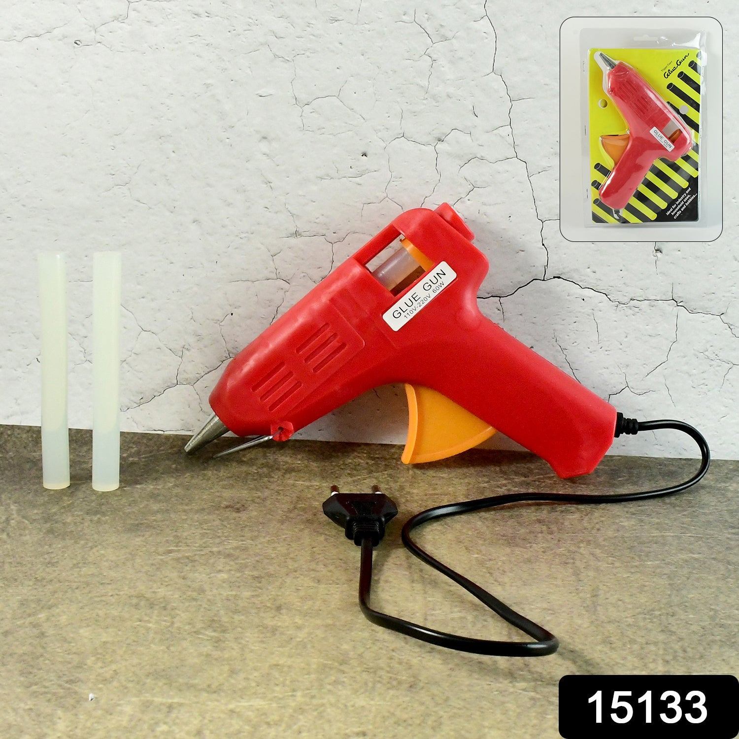 Close-up of the hot melt glue gun's ergonomic handle and trigger.