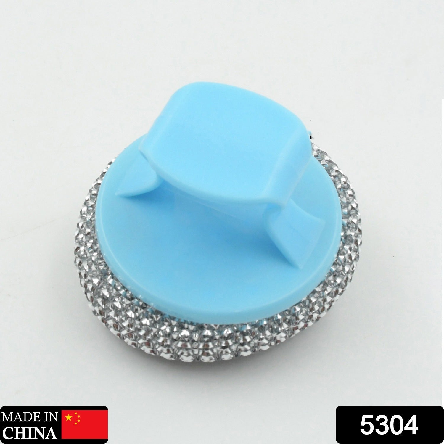 Ergonomic palm dish brush tackling tough stains on a pot