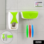 Close-up of toothpaste being dispensed automatically from the wall-mounted unit.