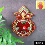 Close-up of decorative wooden Kalash wall hanging with stone and pearl accents