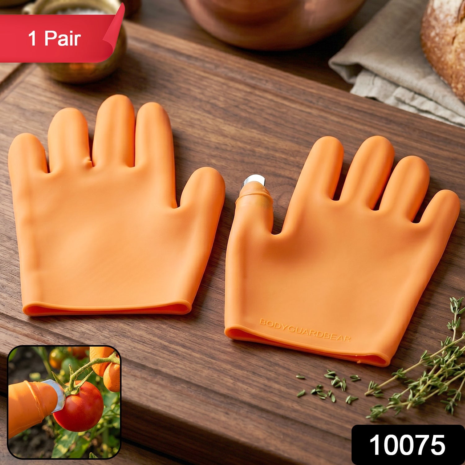 Close-up of finger protector on bright orange silicone gloves