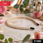 Front view of pearl hairband on white background, chic and elegant