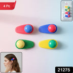 Decorative snap hair clips arranged on a smooth surface