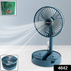 A blue Portable Desktop Fan placed on an office desk, ready for personal cooling.