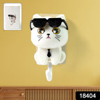 Self-adhesive cat key holder with sunglasses lifted, showcasing its clever mechanism.