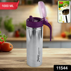 Glossy stainless steel oil pourer container showing sleek cylindrical body