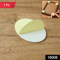 Round adhesive furniture pad on chair leg for floor protection
