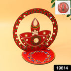 Close-up of wooden diya stand featuring vibrant festive colors and stone embellishments