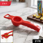 Hand holding the lemon squeezer to extract fresh juice from a lemon.