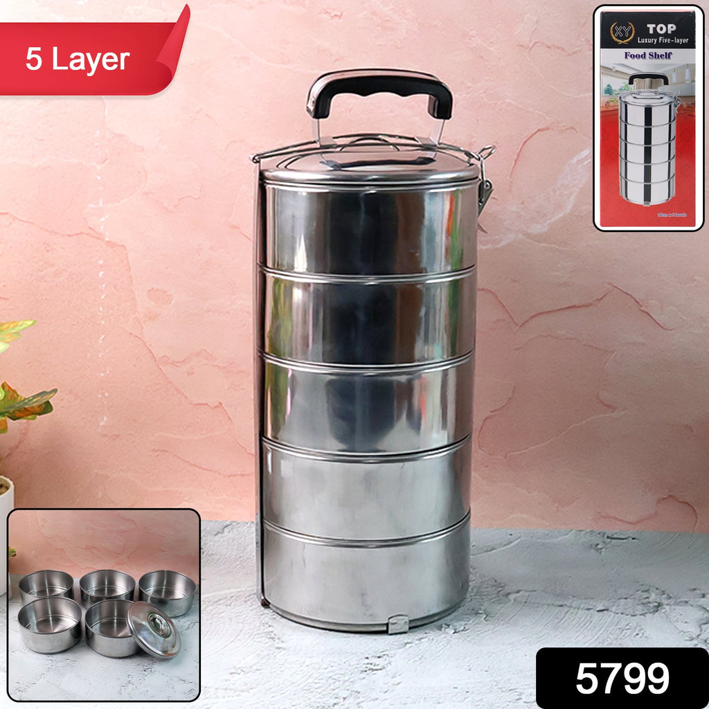 Overhead view of the five distinct compartments inside the tiffin box.