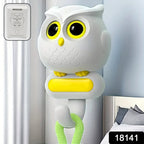 Set of two self adhesive bird hooks mounted on a wall, showcasing their decorative appeal.
