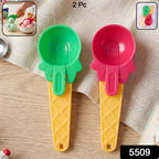 Close-up of the comfortable ergonomic handle on a red plastic ice cream dipper.