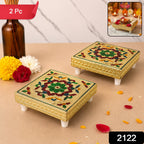 Close-up view of the intricate hand-painted patterns on a decorative wooden chowki, showcasing its artistic details.
