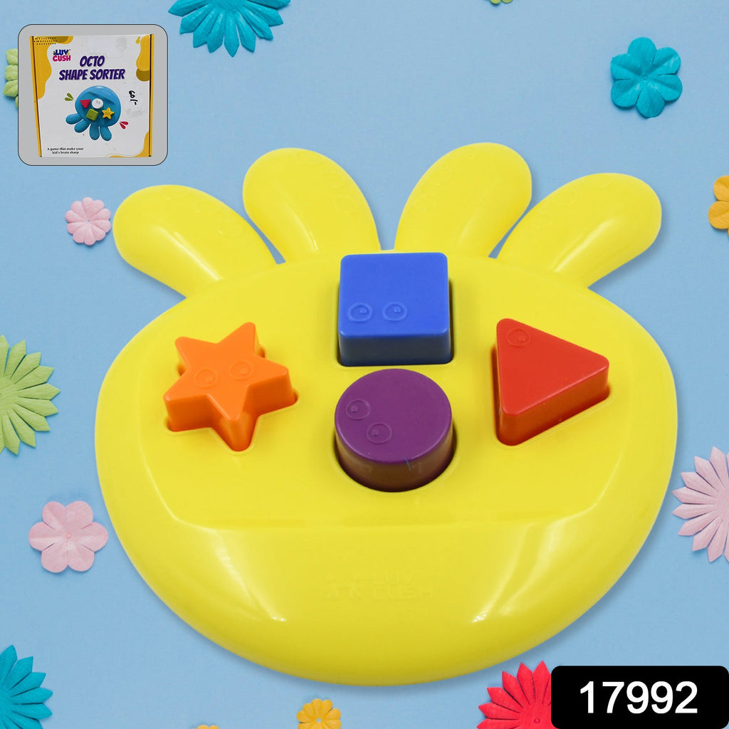 Colorful geometric shapes from the Octo Shape Sorter Toy neatly laid out on a surface.