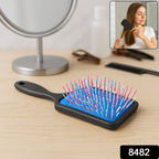 Side view of the ergonomic handle on the Scalp Massager Comb for comfortable grip.