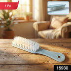 Close-up of multipurpose handheld cleaning brush bristles and ergonomic handle
