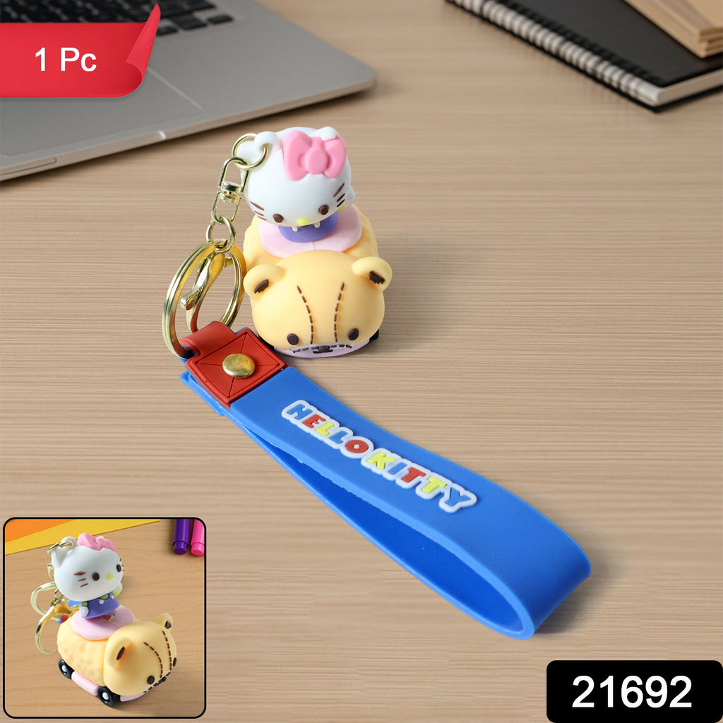 Close-up of cartoon cat riding toy car silicone keychain