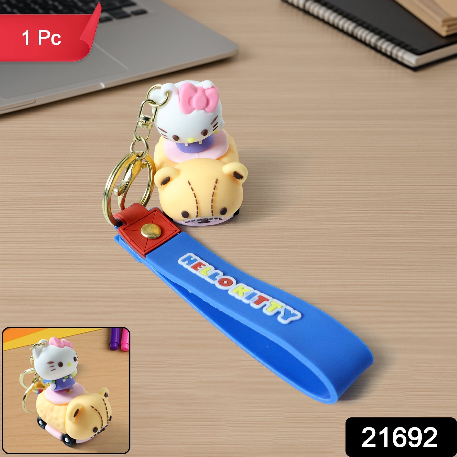 Close-up of cartoon cat riding toy car silicone keychain